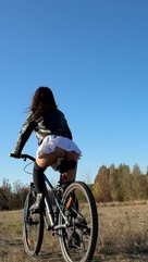 I ride a bike in a very short skirt and a thong